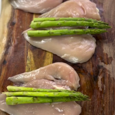 Step 1.1: Lay 3 asparagus spears on each piece, season both sides with salt and pepper