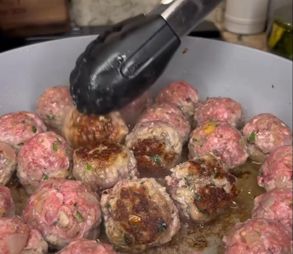 Step 2.1: Add more olive oil to the pan if necessary and cook meatballs on both sides until browned