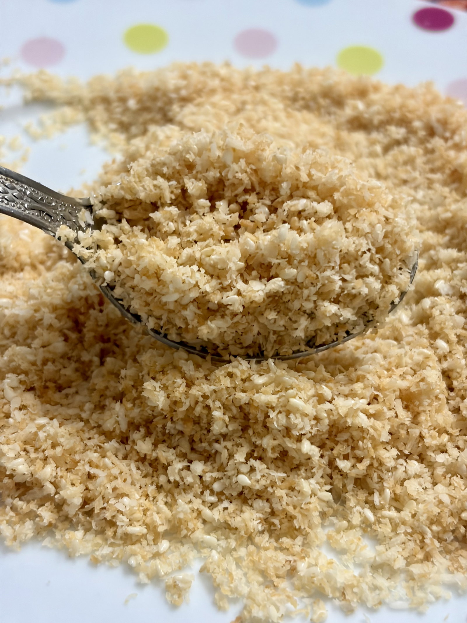 Step 1.2: In a pan over low heat, dry roast the desiccated coconut and sesame seeds