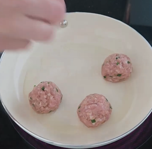 Step 1.1: Heat up some oil on medium heat and add the balls to the pan