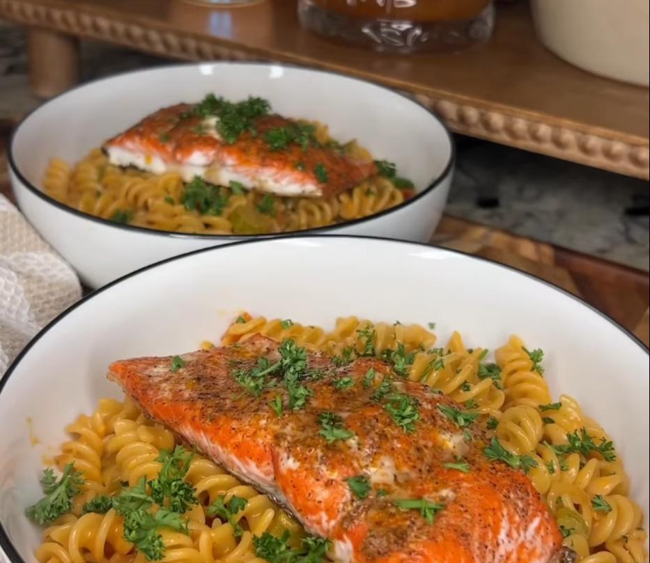 Step 3.1: Serve the baked salmon over cooked pasta and spoon the creamy sauce generously over the top