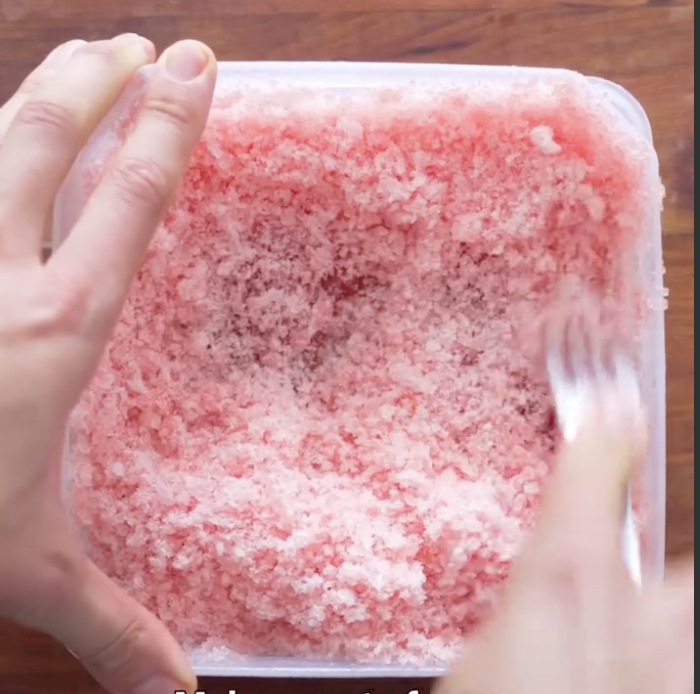 Step 1.1: Scrape the frozen juice with a fork to make the granita