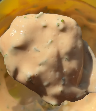 Step 2.1: Mix high-protein Greek yogurt with garlic powder, ketchup, chopped coriander, and a pinch of salt until well combined