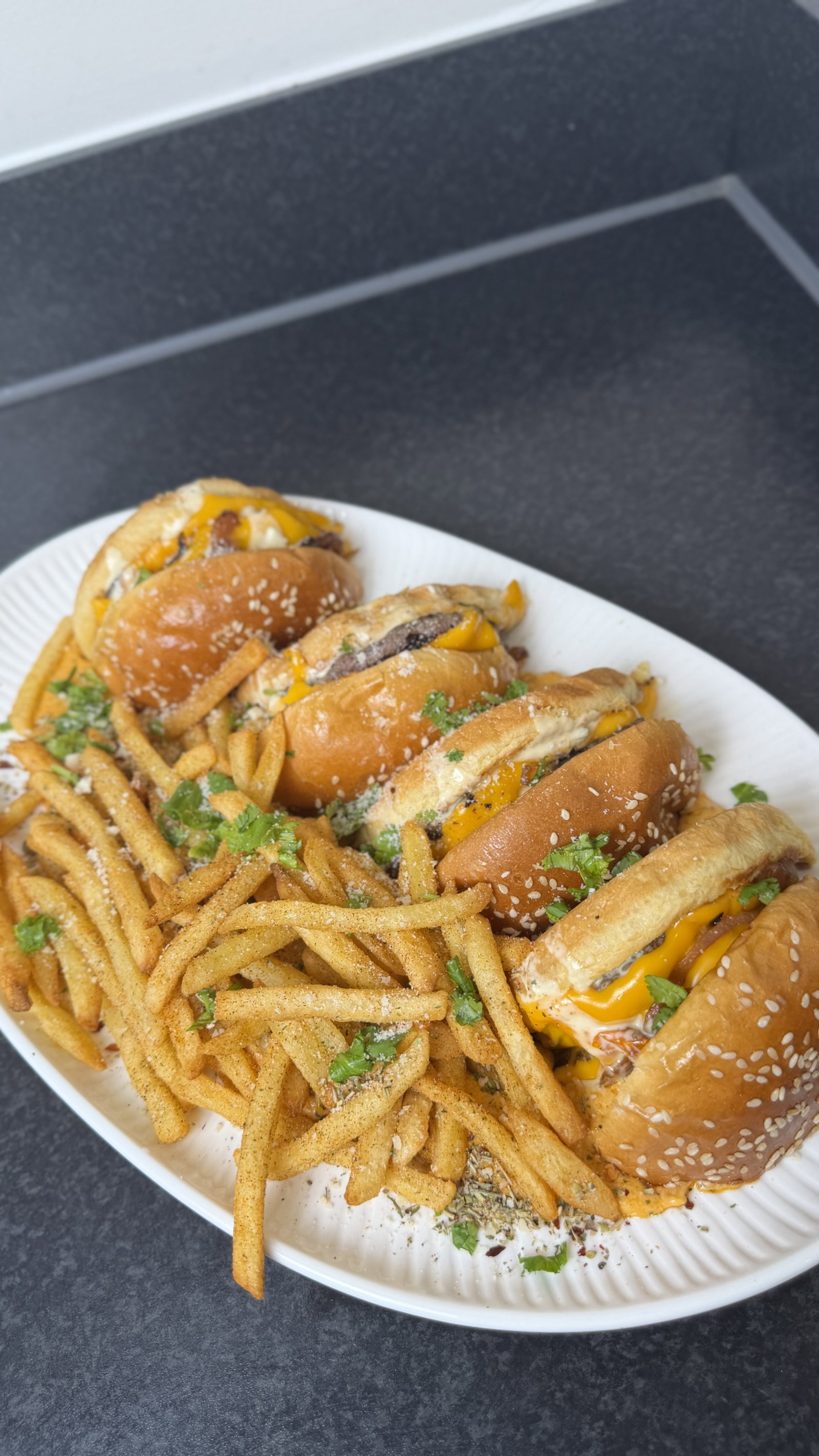 Step 9.2: Slice burgers in half, place in sauce, and serve with seasoned chips