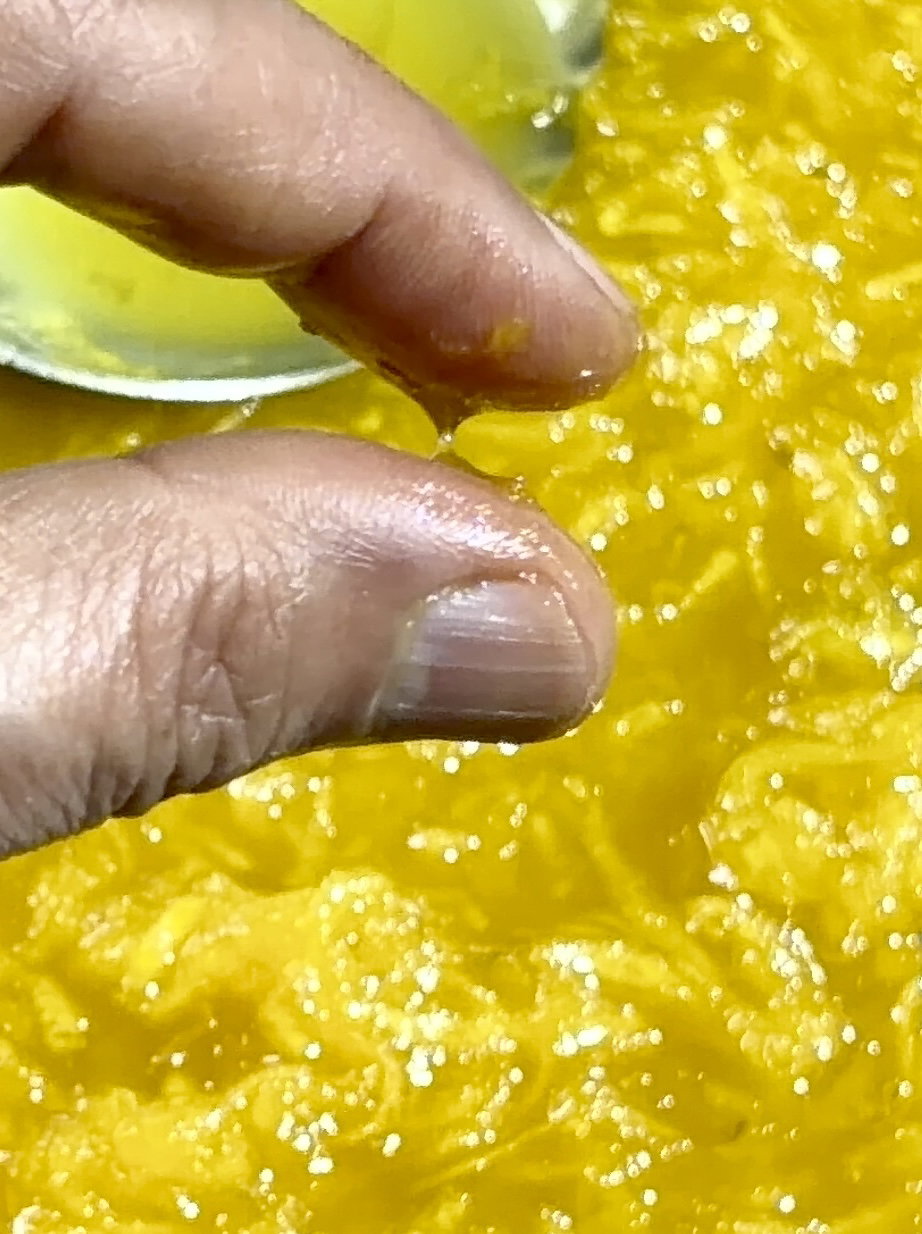 Step 2.1: Check the consistency by cooling a drop of syrup and pressing it between your thumb and forefinger; it should form a single, unbroken thread when pulled apart