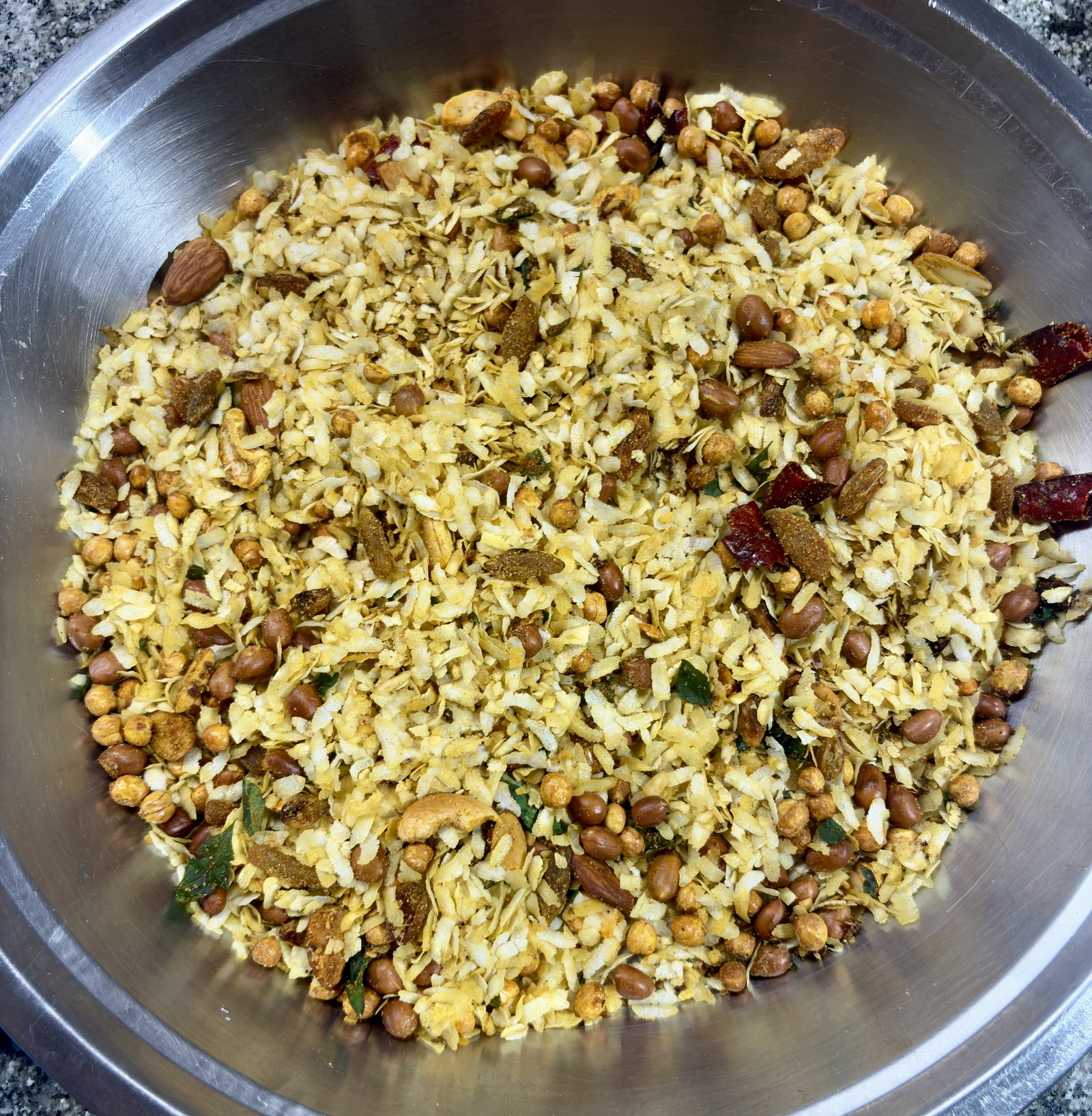 Step 5.1: Turn off the heat and transfer the Chivda to a large, wide tray to cool down to room temperature