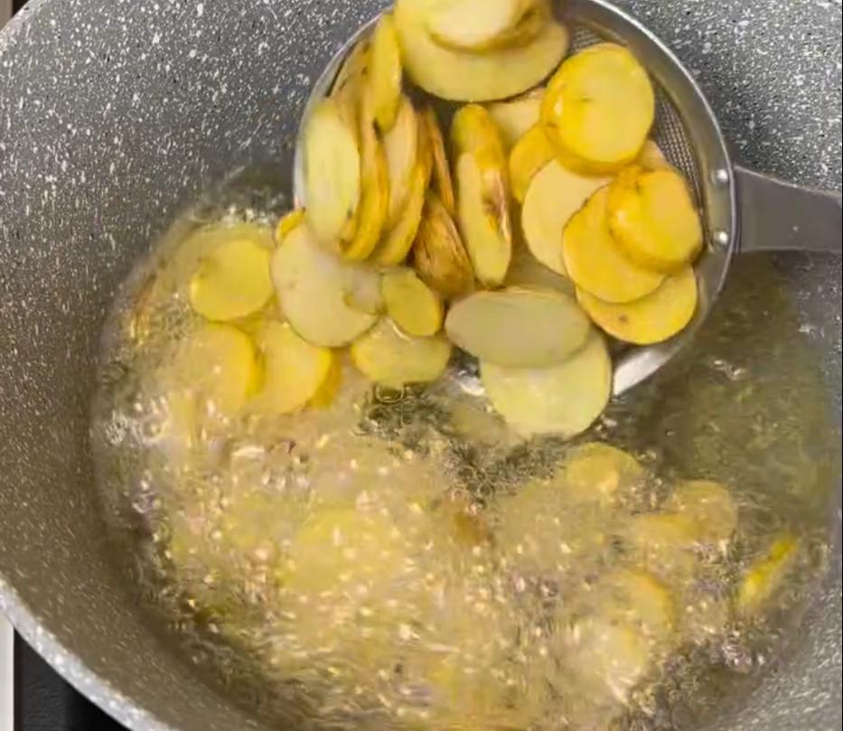 Step 1.1: Fry the potatoes for 10 minutes until they start to crisp, then drain and fry for another 5 minutes until golden brown