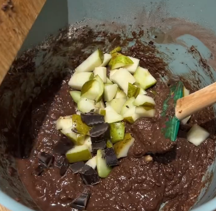 Step 1.1: Fold in the chopped pear and dark chocolate chunks gently