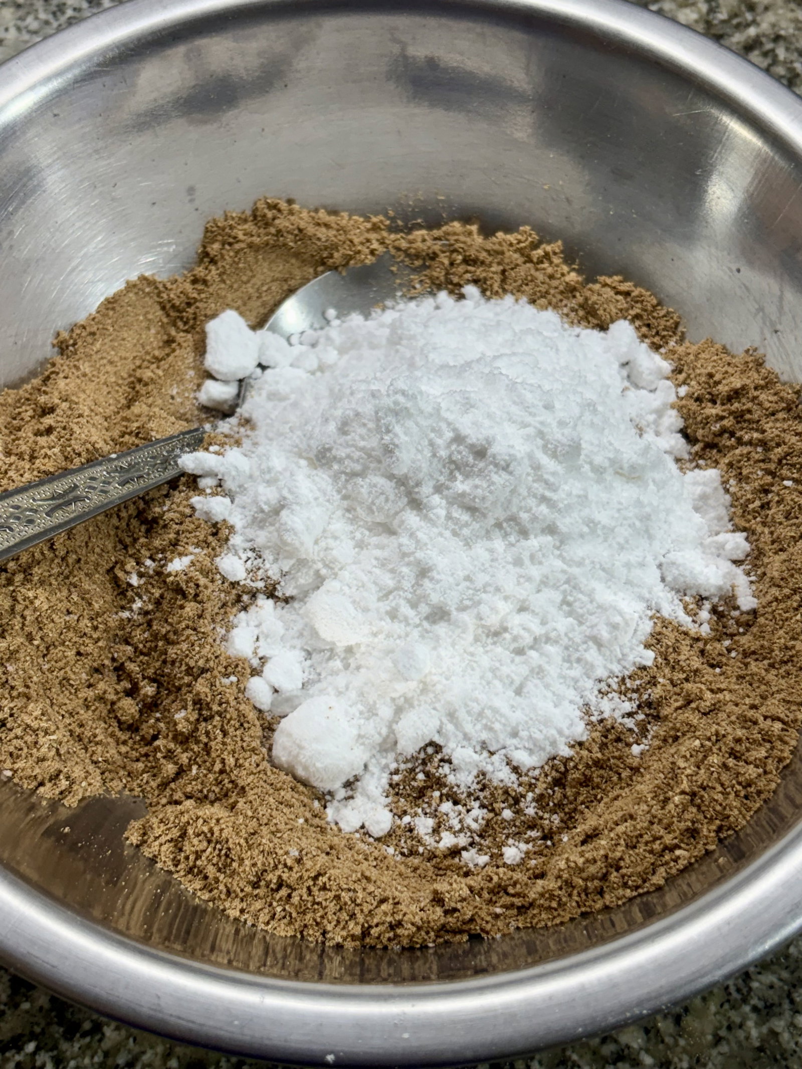 Step 2.1: Add the powdered sugar and mix thoroughly, breaking up any lumps with your fingers or a spoon to ensure a smooth texture