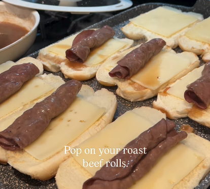 Step 1.1: Once the cheese starts to melt, add the roast beef slices to each sandwich