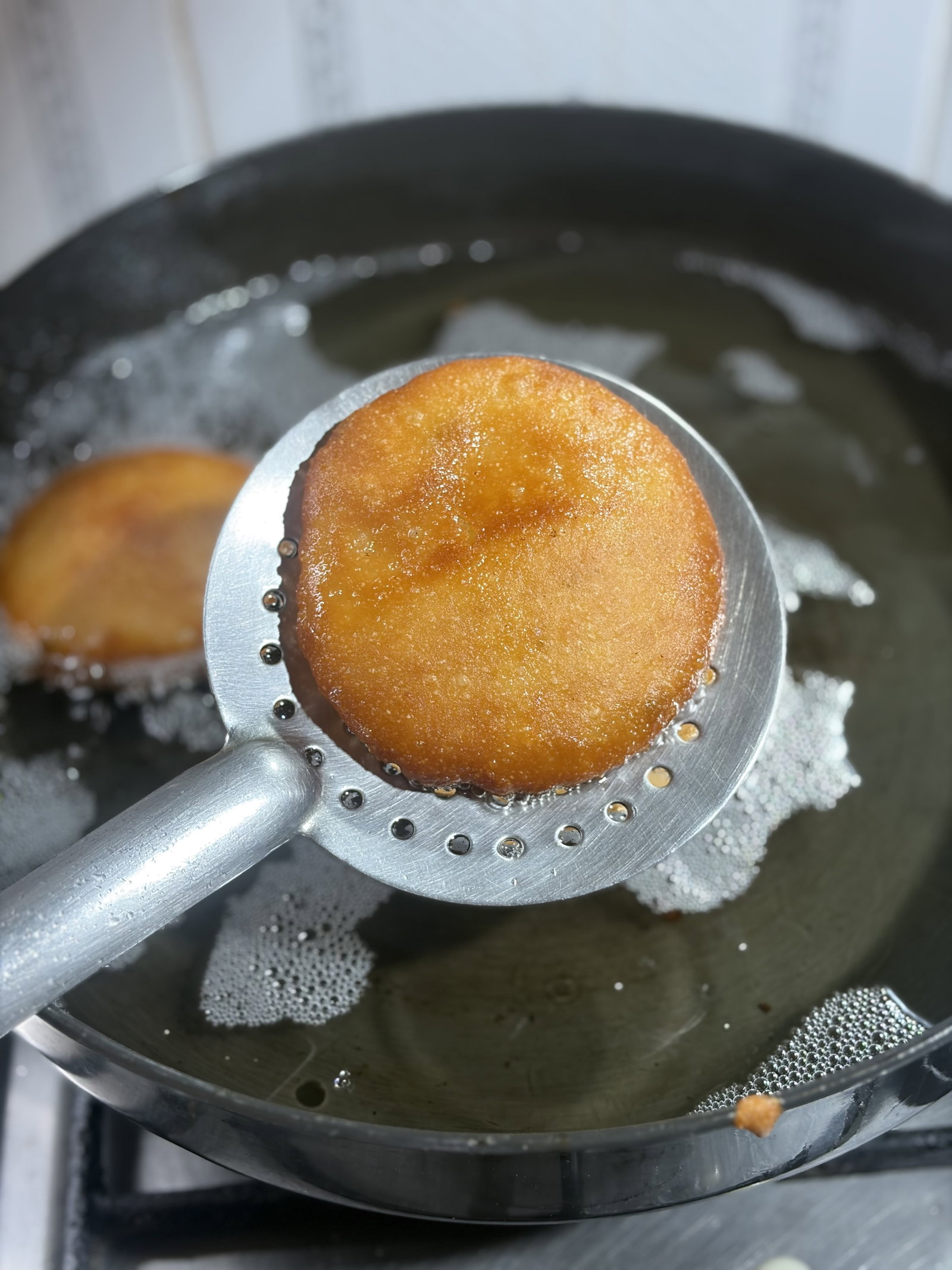 Step 2.1: Take the Malpua out and place it on a paper towel to remove extra oil