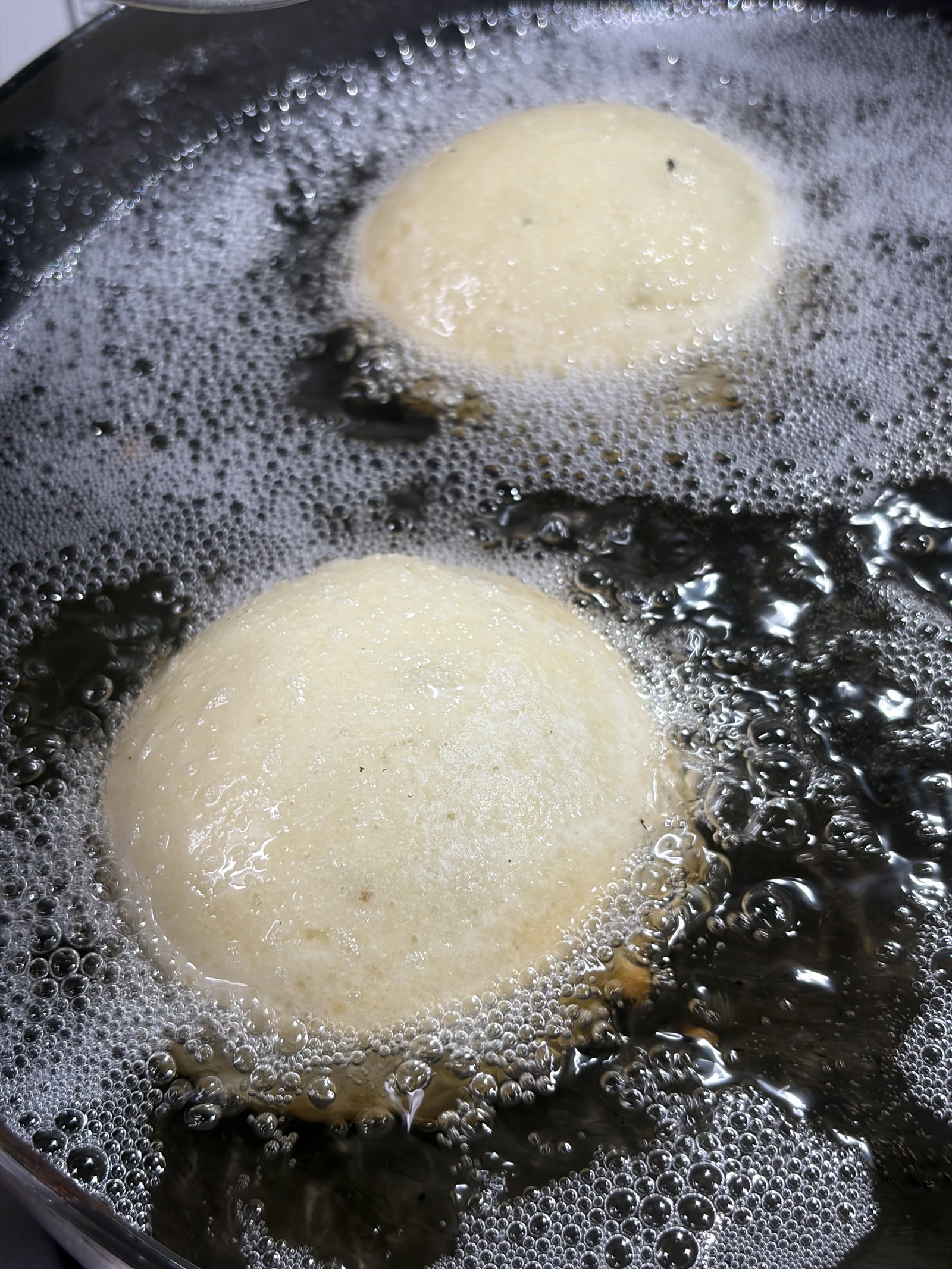 Step 2.2: Using a round ladle, pour a small amount of batter into the centre