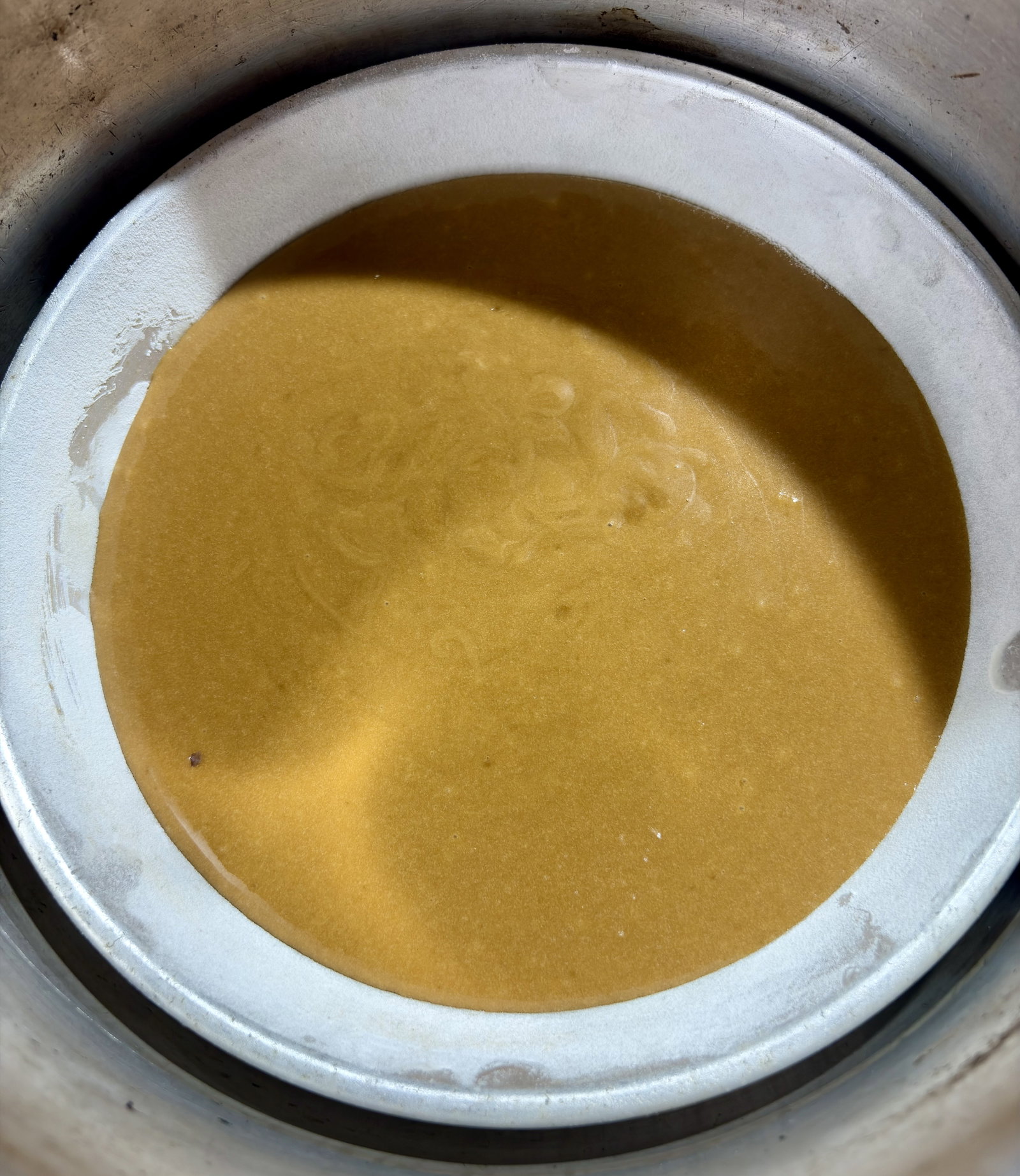 Step 4.1: Set the cake tin on the stand inside the preheated pot
