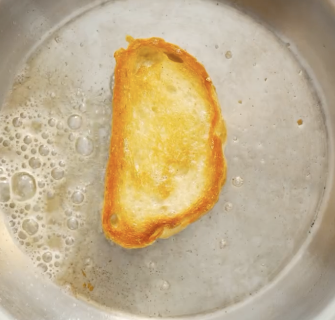 Step 4.1: Butter and toast the bread until golden