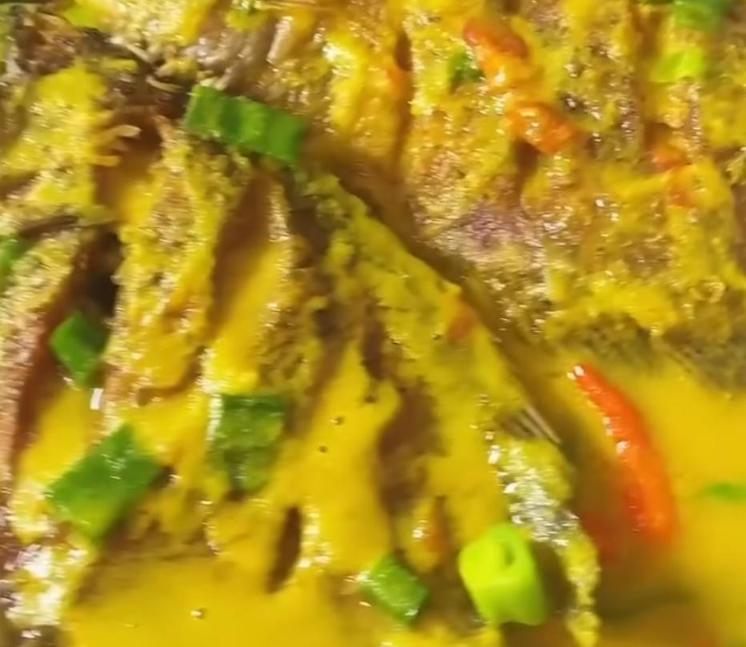 Step 1.1: Add the fried fish to the sauce and simmer for 5 minutes, then finish with a squeeze of lime