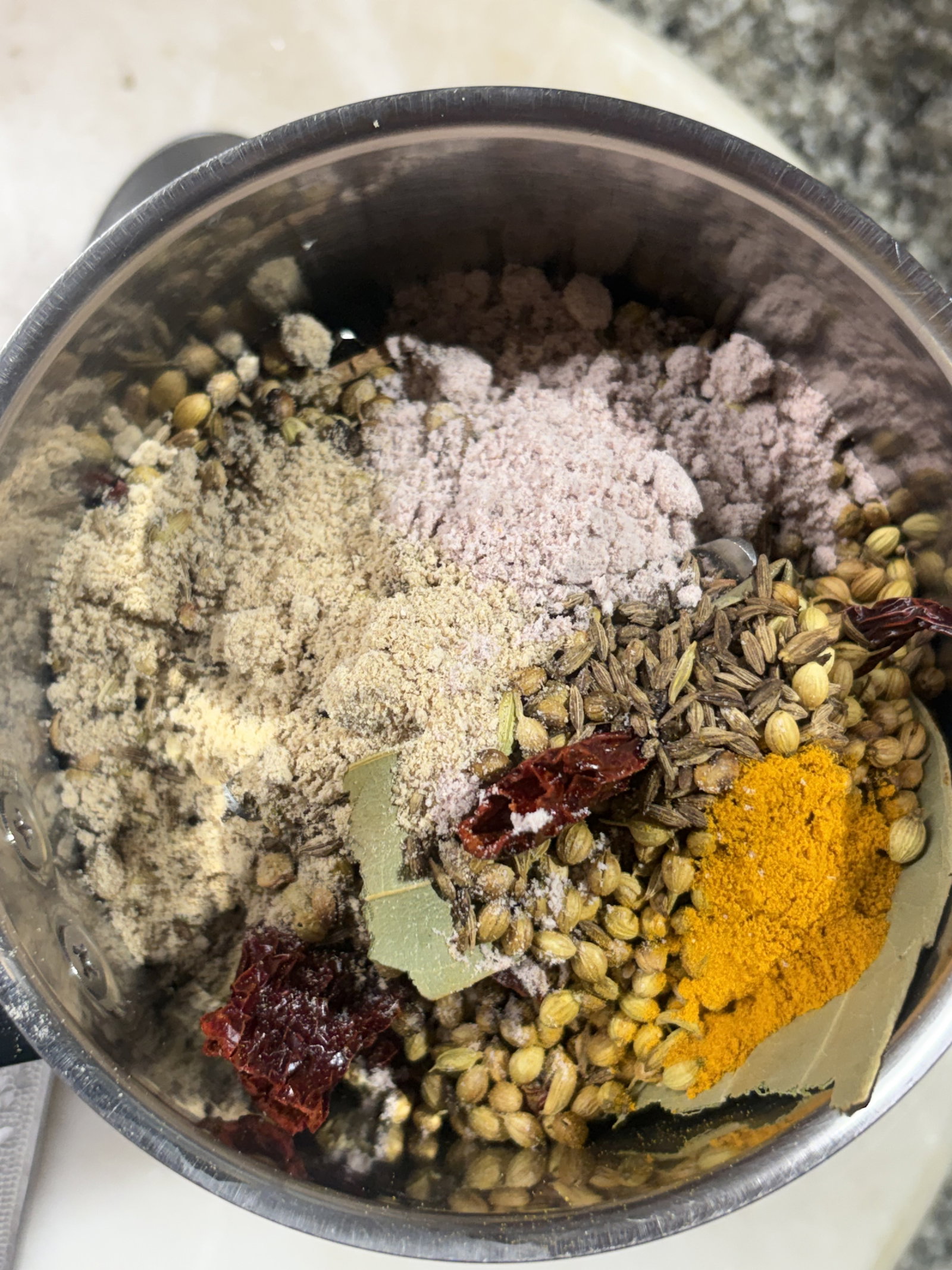 Step 3.1: Once cooled, put the roasted spices into a dry grinder