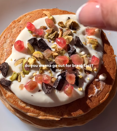 Step 3.1: Stack the pancakes and add your desired toppings such as yogurt, pomegranate seeds, dark chocolate, and crushed pistachios