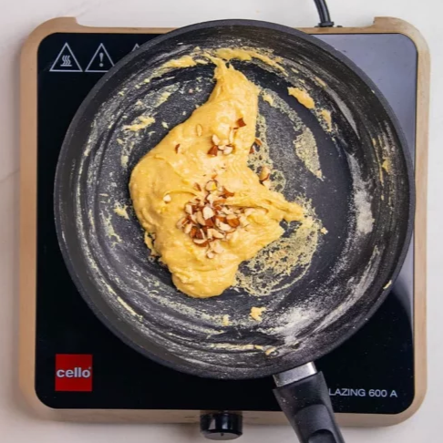 Step 1.2: Cook on low heat until the mixture thickens and starts to separate from the sides of the pan
