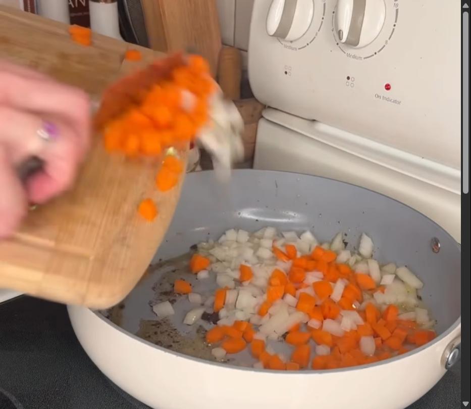 Step 2.1: Add butter to the pan and sauté onions, carrots, and garlic until softened and fragrant