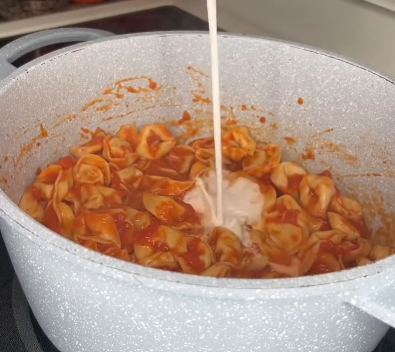 Step 3.1: Plate the tortellini and sauce alongside the chicken cutlets