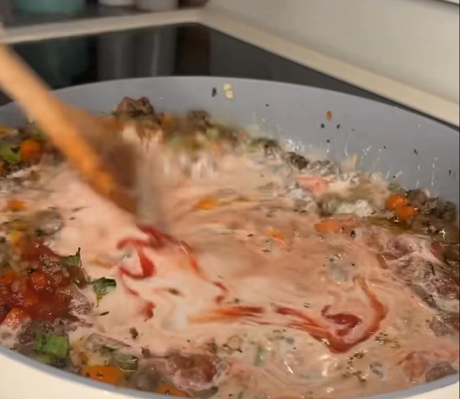 Step 1.1: Stir in tomato sauce, chicken broth, and heavy cream, and bring to a boil