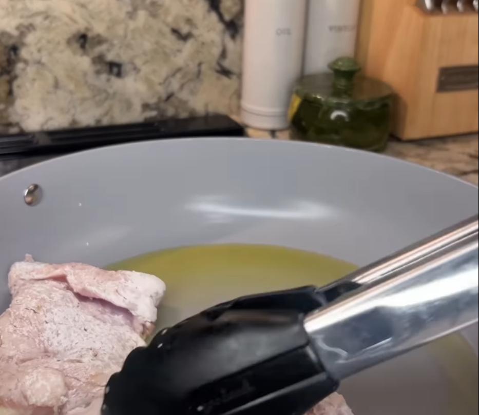 Step 1.1: Dredge the chicken thighs in cornstarch until both sides are coated