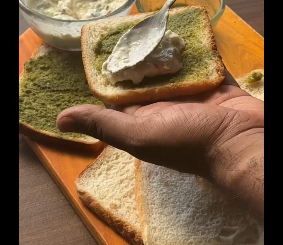 Step 1.1: Spread green chutney over a bread slice, then add the curd mix