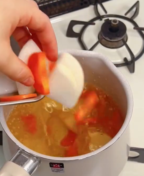 Step 1.1: Simmer the chopped vegetables and fried tofu in the dashi stock