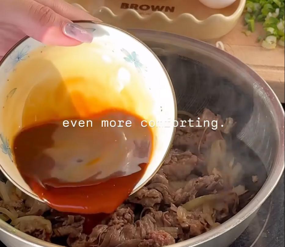 Step 1.1: Add the beef and cook until it changes colour, then pour in half of the sauce and let it reduce until glossy and slightly thickened
