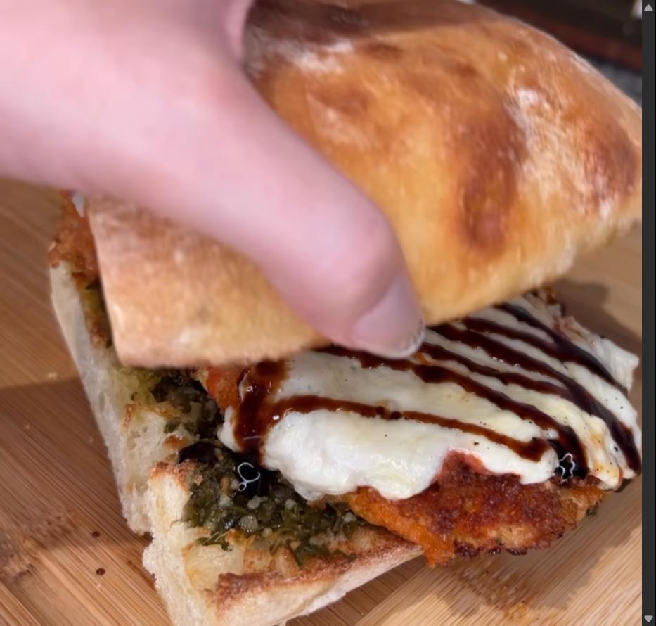 Step 3.1: Spread pesto on one side of ciabatta, then top with chicken and drizzle with balsamic glaze