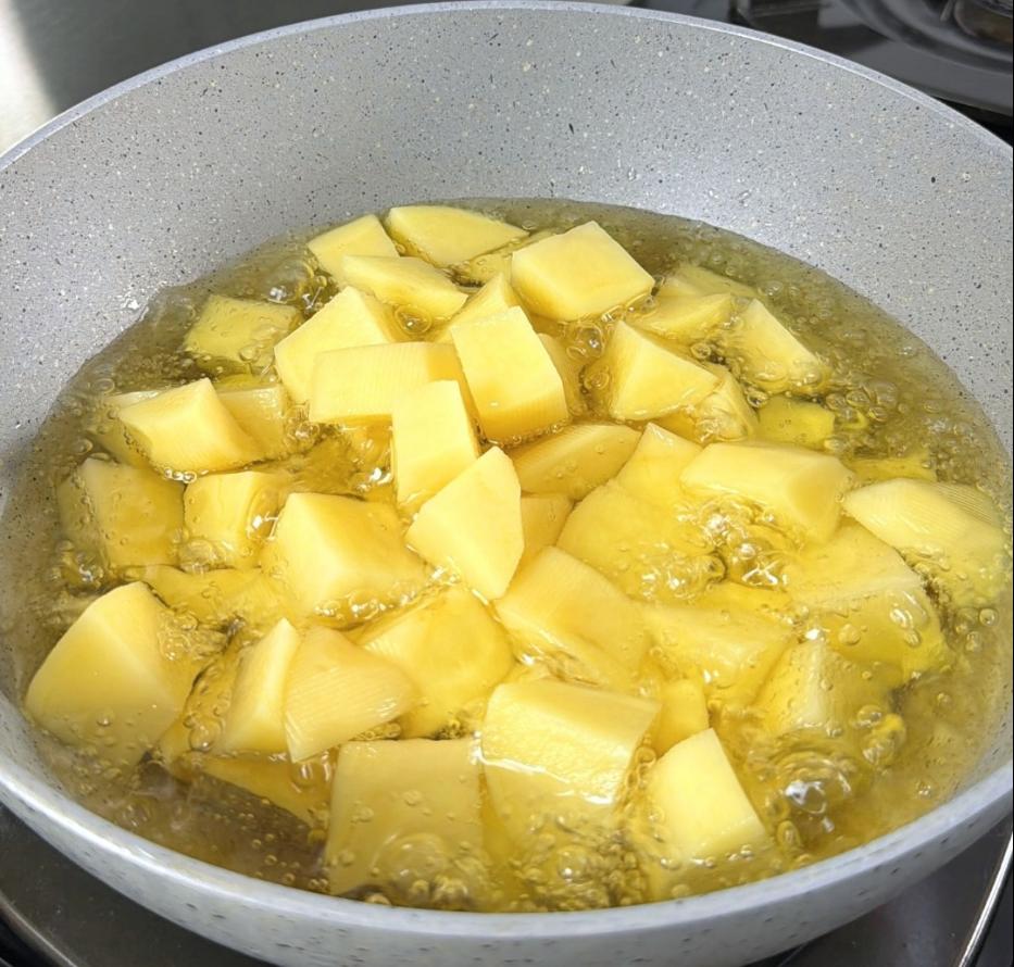 Step 1.1: Fry the potatoes over medium heat until golden and soft