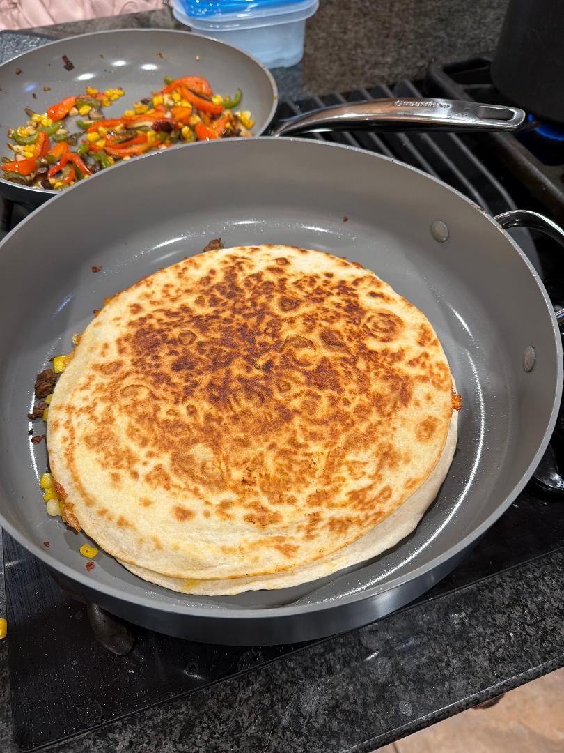 Step 3.1: Cook the quesadilla for 10 minutes, flipping halfway through, until both sides are crispy