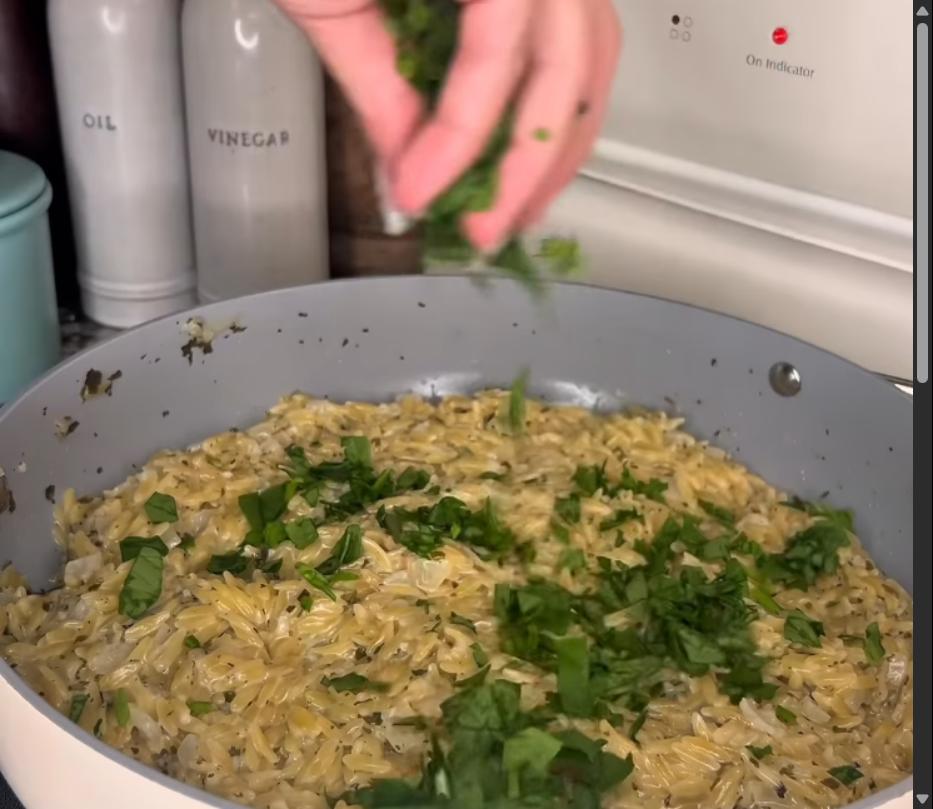 Step 2.1: Toss in chopped spinach and grated Parmesan, stirring until the spinach is wilted and the Parmesan is melted