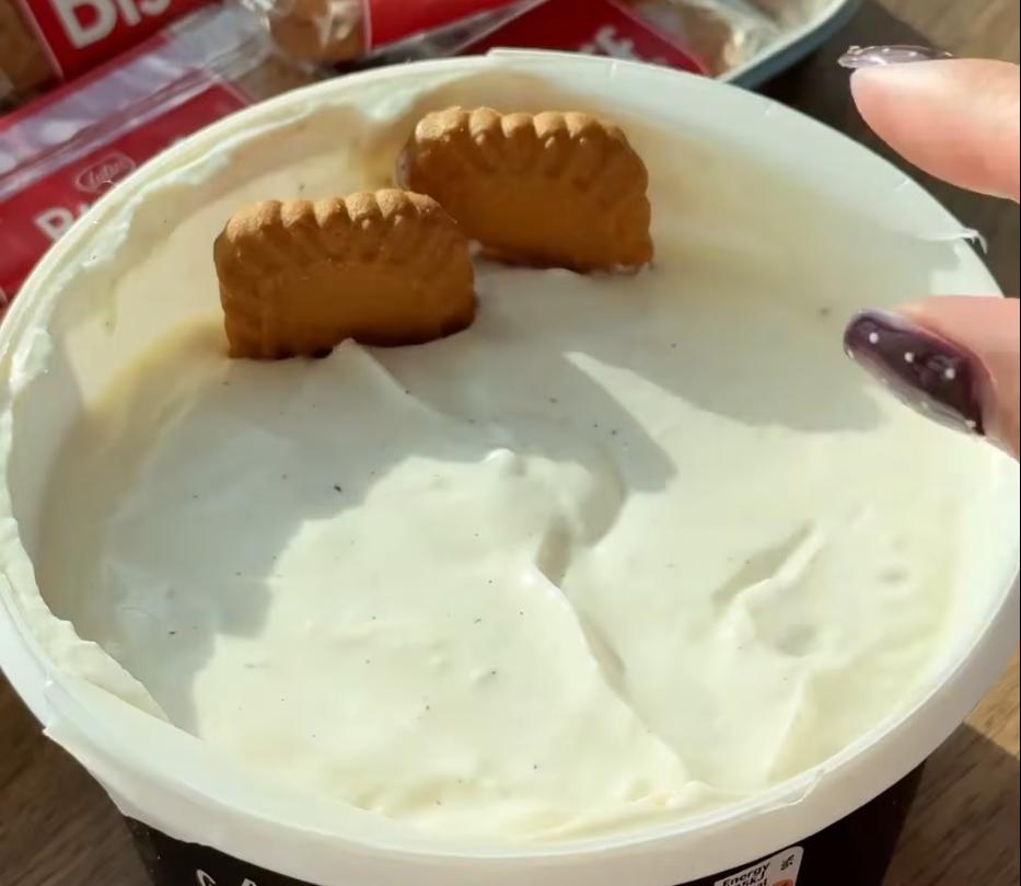 Step 1.1: Place the Biscoff biscuits vertically into the yoghurt, packing in as many as you can