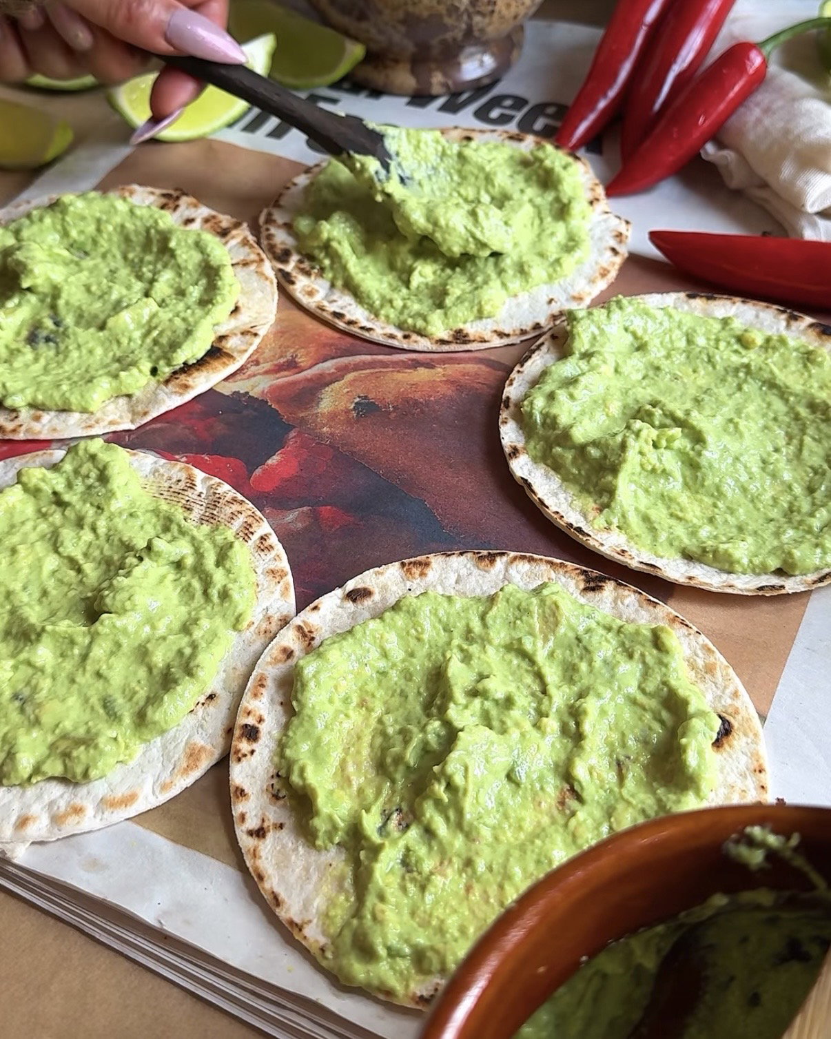Step 5.2: Spread a thick layer of avocado crema on the tortilla