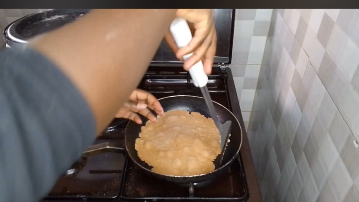 Step 2.1: Place one chapati on the hot pan and cook until bubbles begin to form