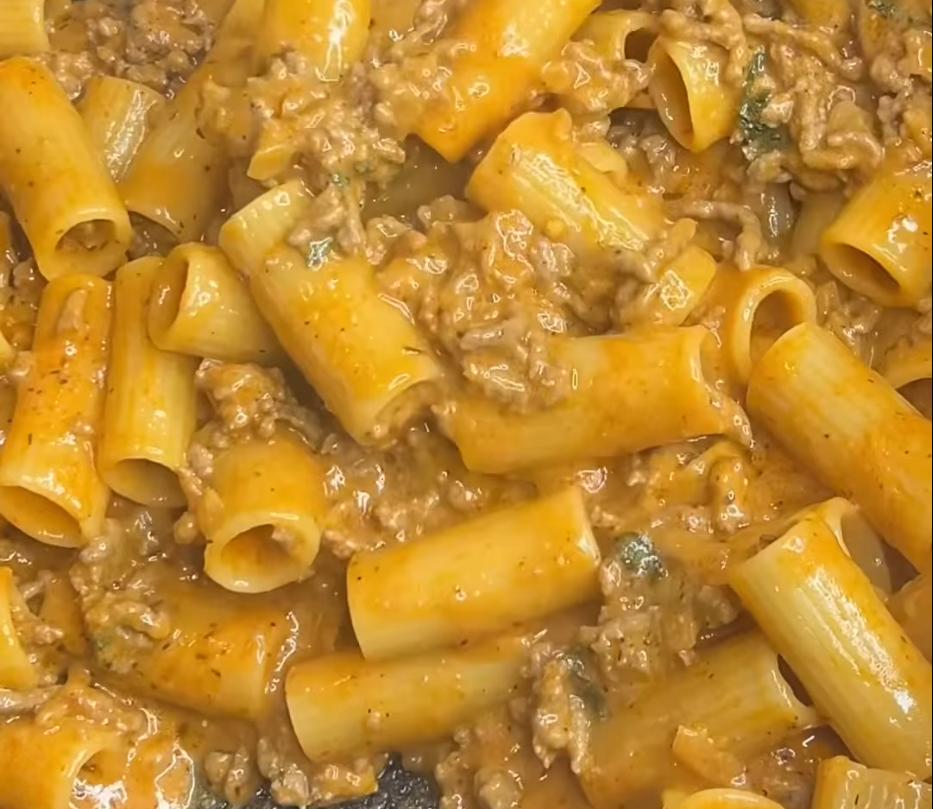 Step 1.1: Add the cooked rigatoni back in and stir to combine, ensuring the pasta is well coated with the sauce