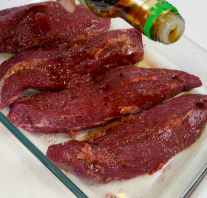 Step 1.1: Drizzle Worcestershire sauce and soy sauce over the steak