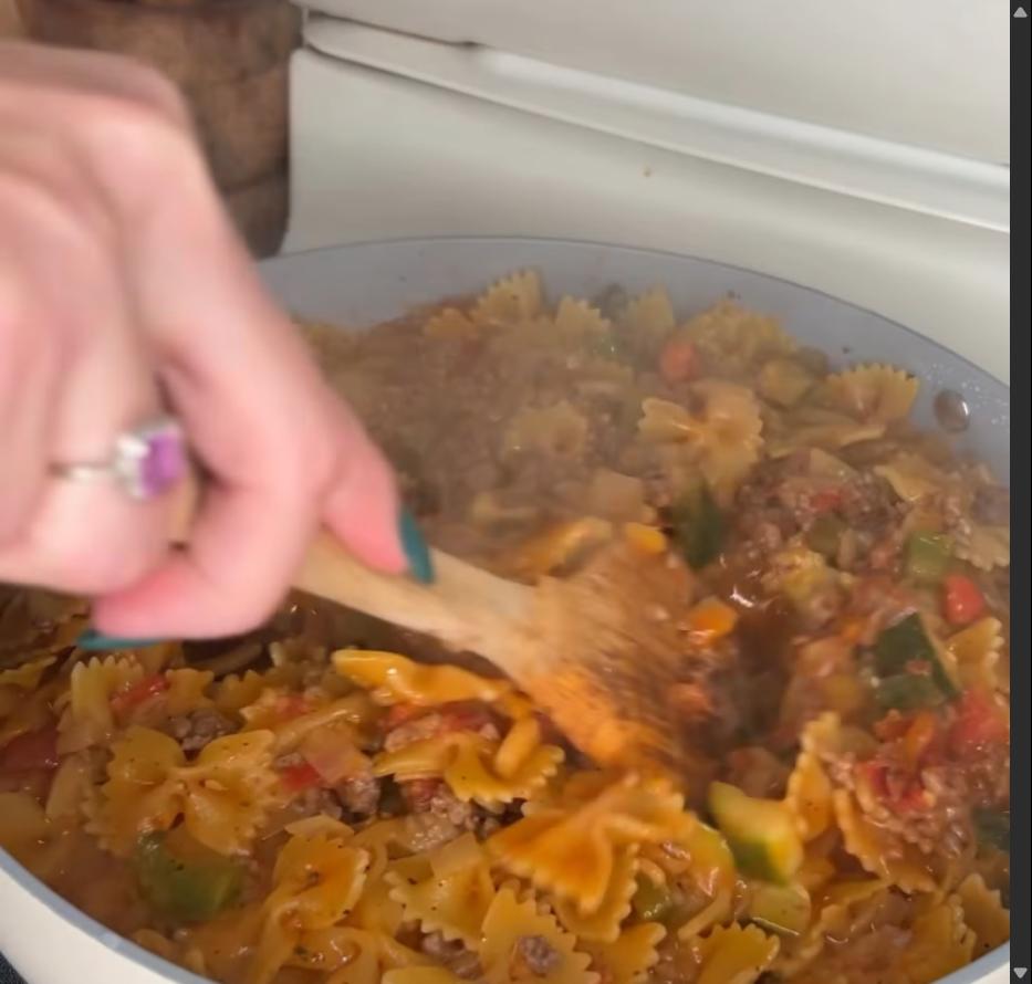 Step 1.1: Cover with a lid, lower heat, and simmer for 10-15 minutes until pasta is cooked through and most of the liquid is absorbed