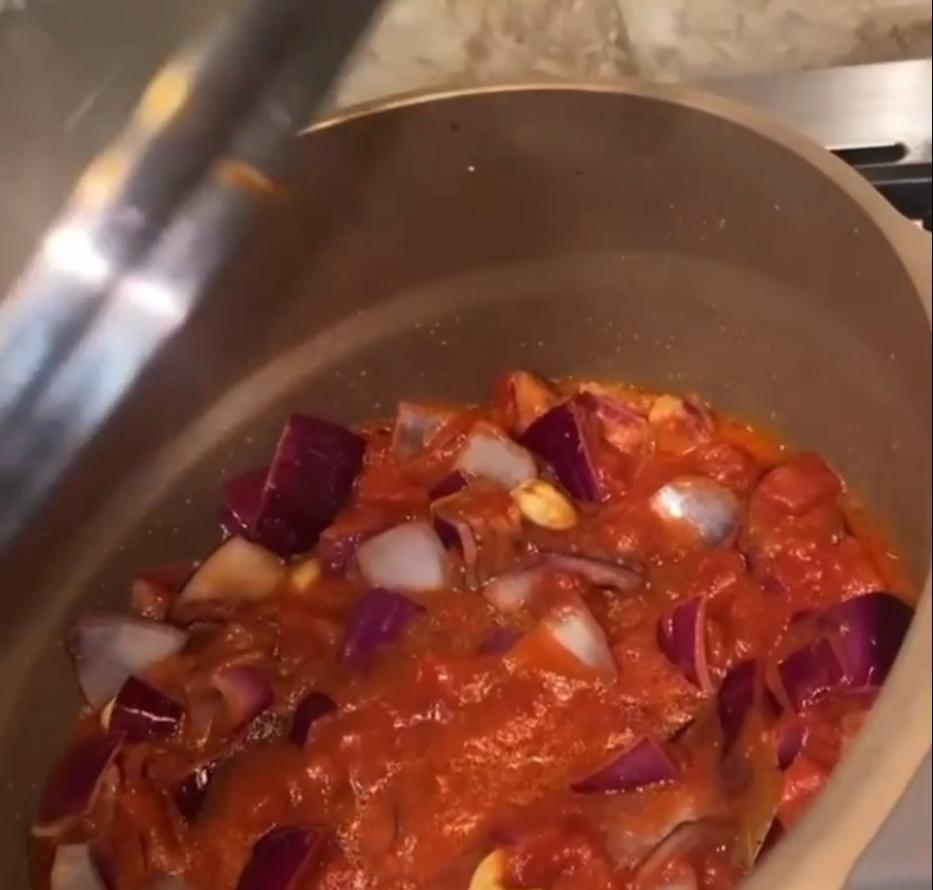 Step 2.1: Add the canned tomatoes and 1/2 cup water and bring to a simmer, then season with the sugar, pepper, and salt