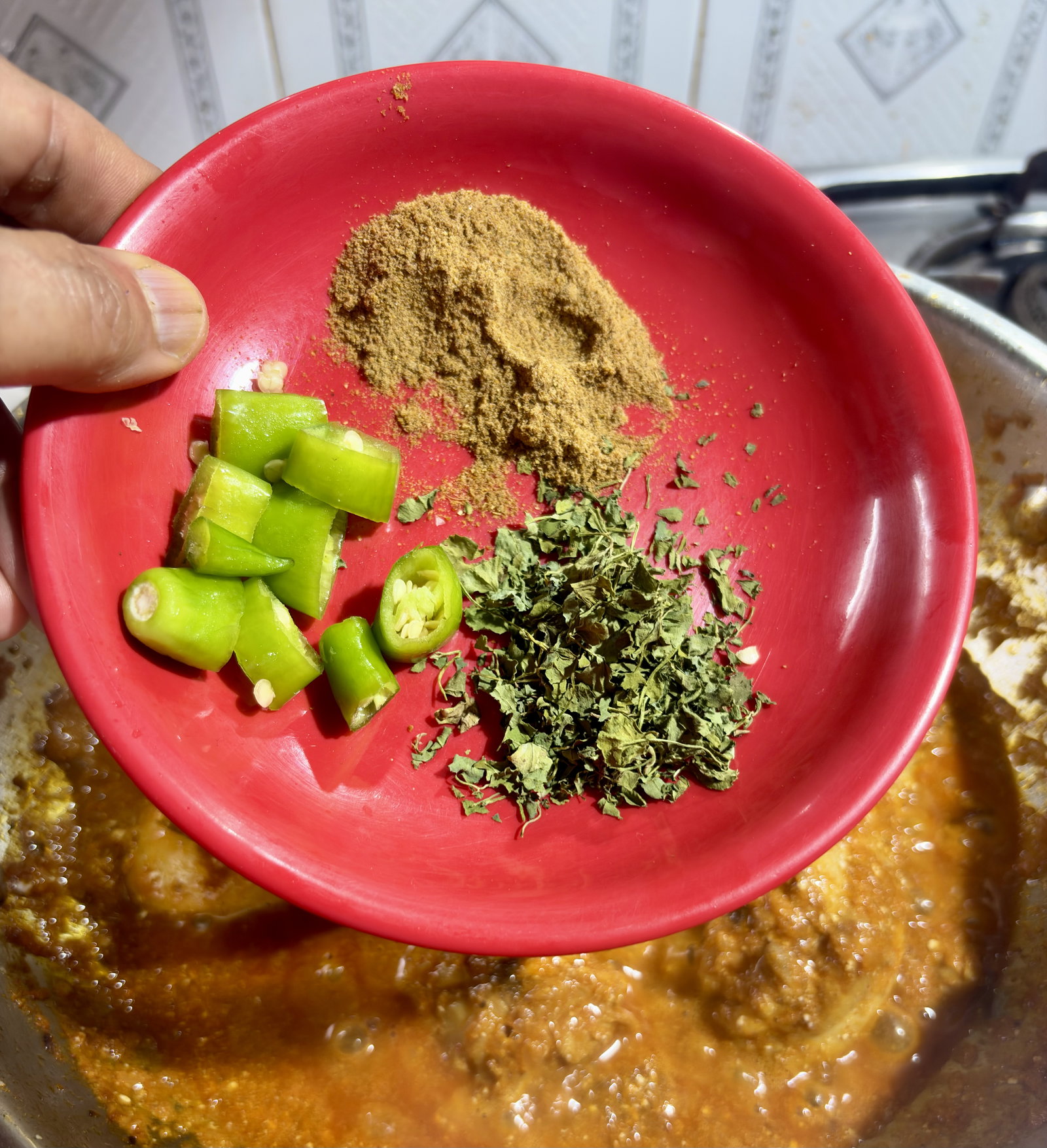 Step 4.1: Add the chaat masala, crushed kasuri methi and green chillies, if using and mix well