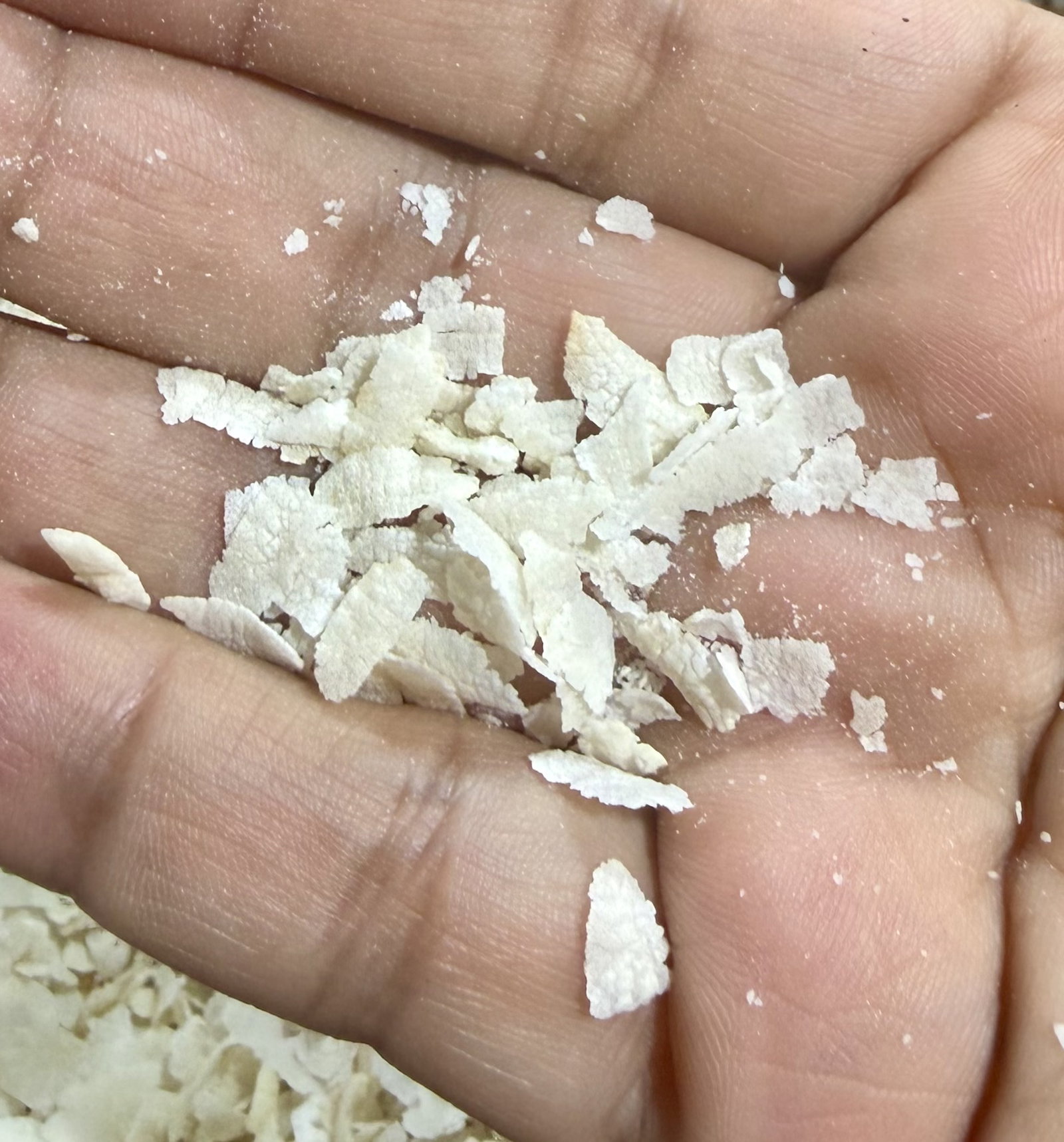 Step 1.1: Once the poha becomes crisp and slightly curls up at the edges, transfer it to a large mixing bowl and set aside