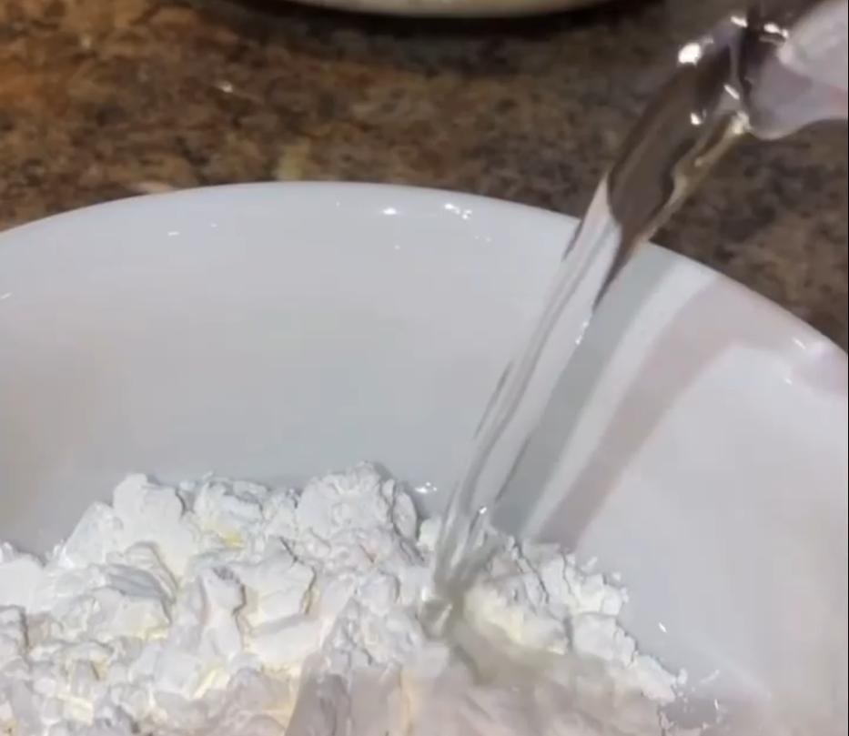 Step 1.1: Mix the corn flour with a little water until smooth, then pour it into the boiling milk while whisking