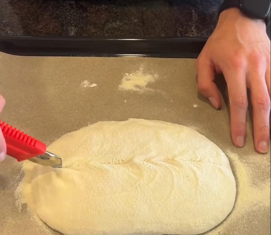 Step 1.1: Once risen, score the top of the dough