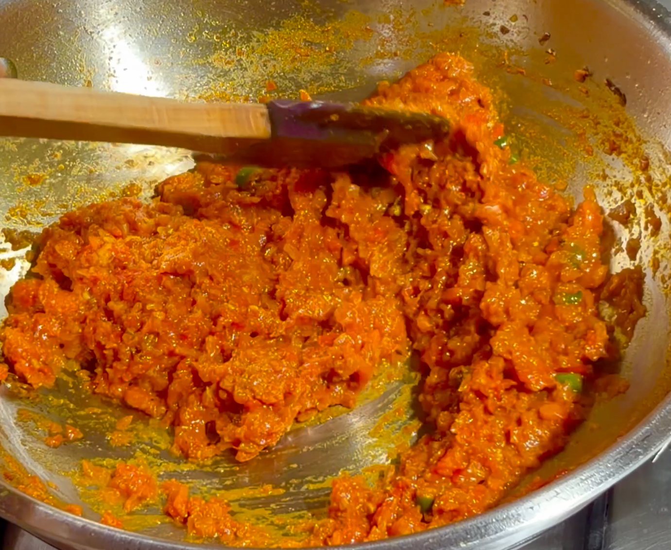 Step 2.2: Add chopped tomatoes and cook over medium-high heat until soft and mushy, and the oil begins to separate from the sides of the masala