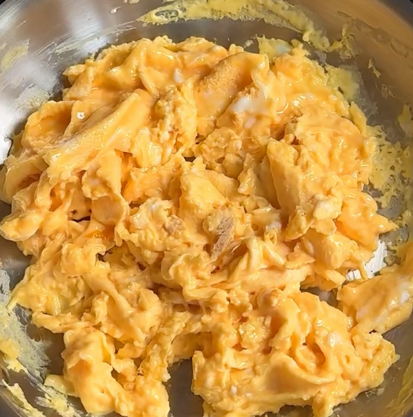 Step 1.1: Heat a pan with 1 tsp of olive oil, pour in the eggs, stir continuously, and scramble