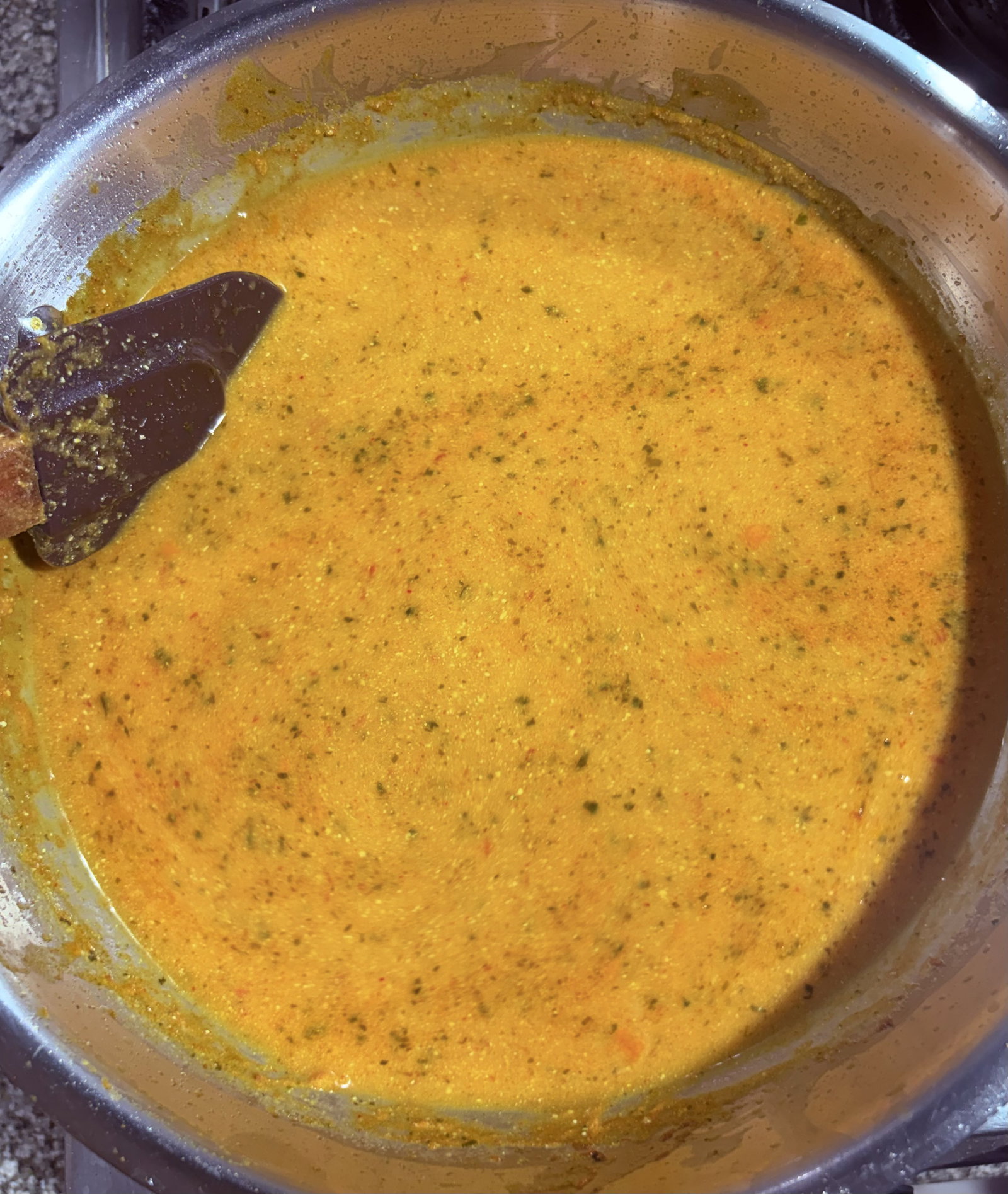 Step 4.1: Pour in warm water, stir well, and bring the gravy to a rolling boil