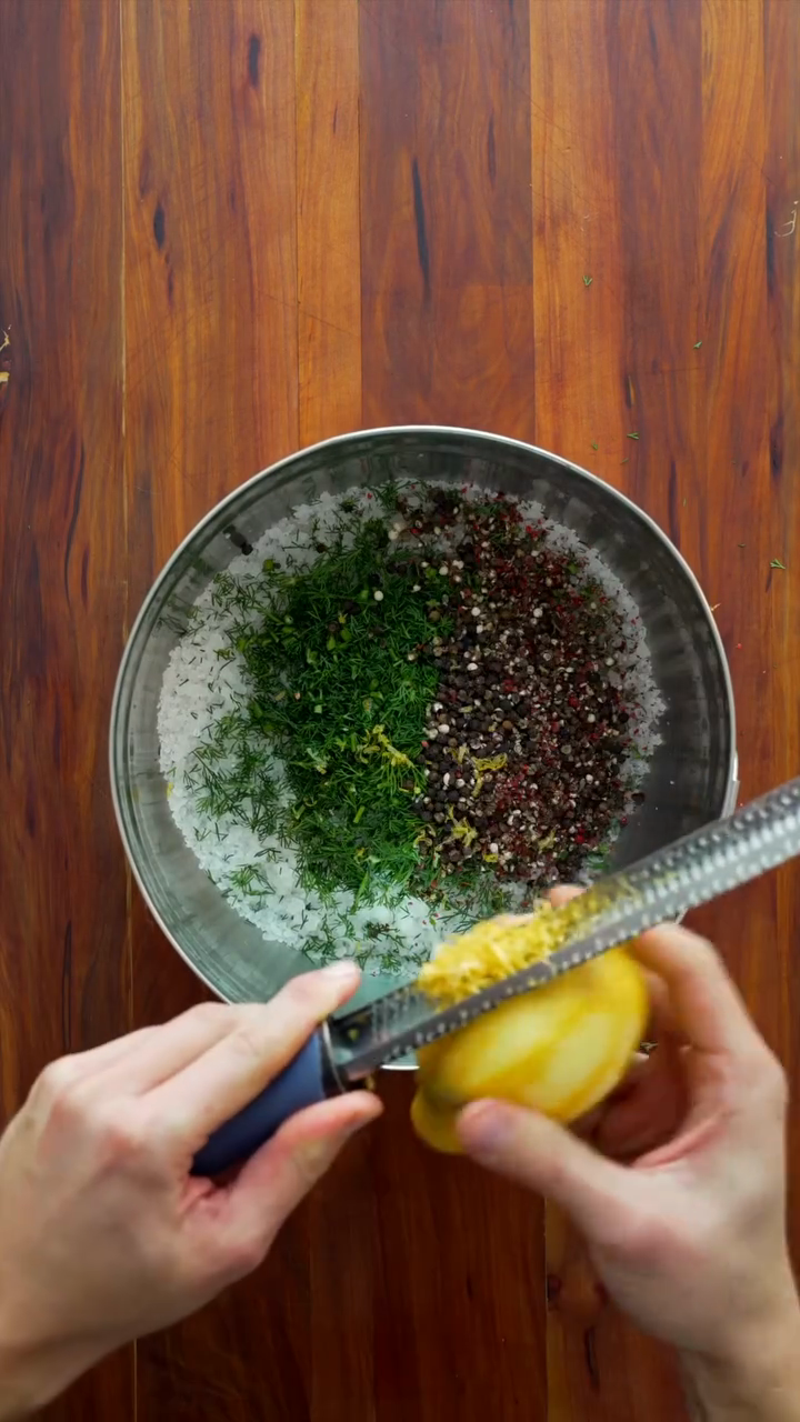 Step 1.1: Mix the coarse salt, sugar, lemon zest, chopped dill, and crushed five-berry pepper in a bowl