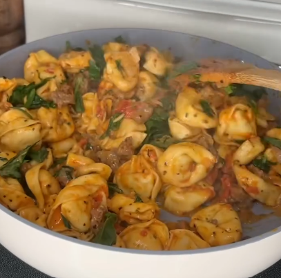 Step 1.1: Bring the mixture to a slight boil, then lower the heat and simmer until the tortellini is cooked through and the sauce has thickened