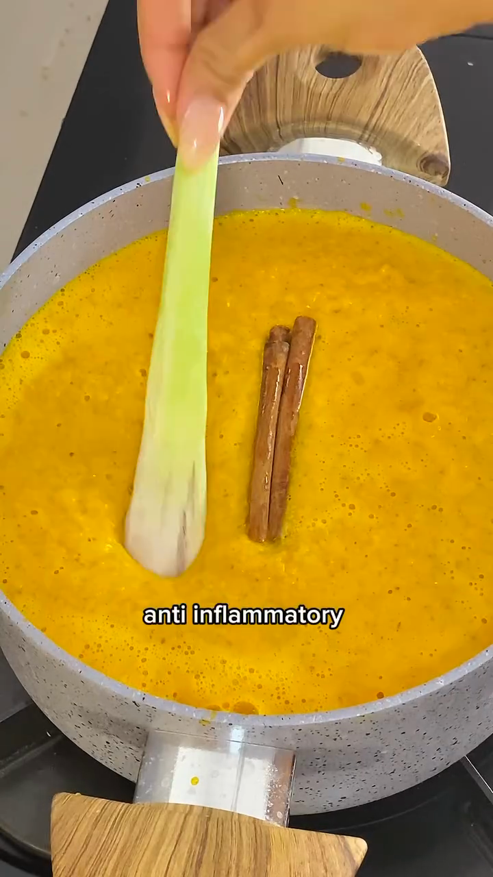 Step 2.1: Add the blended turmeric and ginger, along with lemongrass and a cinnamon stick